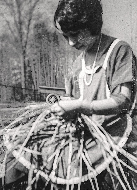 Vintage picture of Harriette weaving a basket for Giving Back to the Community