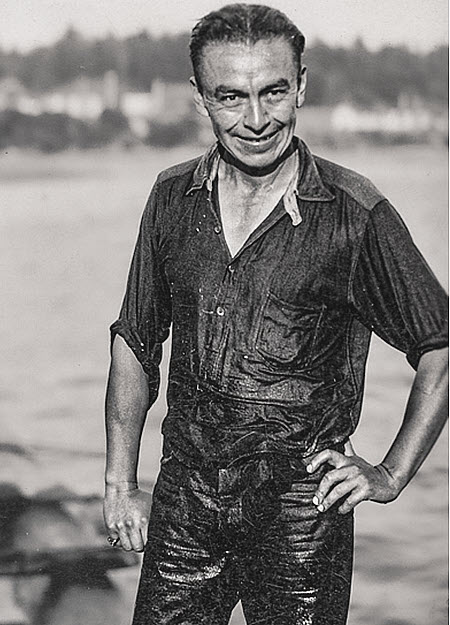 Vintage image of Billy Dunbar standing with the bay behind him taken in the 1930s